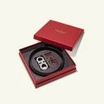 Red rigid belt gift box with rolled belt and buckles